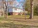 Well-maintained home exterior with backyard deck and stairs at 321 Pleasantview Dr, Greenwood, IN 46142