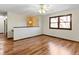 Spacious living room with beautiful hardwood floors, ceiling fan, and natural light at 321 Pleasantview Dr, Greenwood, IN 46142