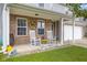 Inviting front porch with rocking chairs, offering a cozy and welcoming entrance to the home at 3430 Parkview Dr, Columbus, IN 47201