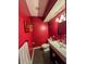 Modern red bathroom with tile floors, vessel sink, and towel rack at 3610 Eagle Emblem Ct, Greenwood, IN 46143