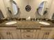 Bathroom featuring a double sink vanity with granite countertops and decorative accents at 3610 Eagle Emblem Ct, Greenwood, IN 46143