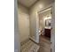 Half bathroom with a single wood sink and a decorative rug by the door at 3610 Eagle Emblem Ct, Greenwood, IN 46143