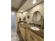 Bathroom featuring a double sink vanity with granite counters and a view into the shower room at 3610 Eagle Emblem Ct, Greenwood, IN 46143