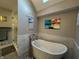 Spa-like bathroom with standalone tub, glass shower, and modern fixtures at 3610 Eagle Emblem Ct, Greenwood, IN 46143