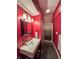 Bright bathroom with modern sink, mirror and lighting, and a shower with a patterned curtain at 3610 Eagle Emblem Ct, Greenwood, IN 46143