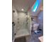 Luxurious bathroom with marble shower, standalone tub, and natural light from skylight at 3610 Eagle Emblem Ct, Greenwood, IN 46143