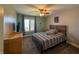 Bedroom featuring a cozy bed, ceiling fan, and a serene window view, creating a relaxing atmosphere at 3610 Eagle Emblem Ct, Greenwood, IN 46143