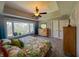 Spacious bedroom featuring a large window with treed view and a walk-in closet at 3610 Eagle Emblem Ct, Greenwood, IN 46143