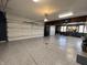 Spacious three-car garage with epoxy flooring, ample storage, and overhead lighting for the car enthusiast at 3610 Eagle Emblem Ct, Greenwood, IN 46143