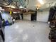 Expansive garage with epoxy floors, multiple garage doors, storage racks and a full wall of storage at 3610 Eagle Emblem Ct, Greenwood, IN 46143