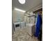 Functional laundry room with sink, shelving, washer, dryer, and light-colored walls at 3610 Eagle Emblem Ct, Greenwood, IN 46143