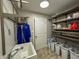 Bright laundry room features shelving, cabinetry, a sink, and a blue coat at 3610 Eagle Emblem Ct, Greenwood, IN 46143