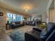Bright living room offering an open concept floor plan that leads into the kitchen at 3610 Eagle Emblem Ct, Greenwood, IN 46143