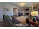 Inviting living room with stone fireplace, leather couches and a decorative rug at 3610 Eagle Emblem Ct, Greenwood, IN 46143
