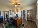 Spacious office with natural light, a wooden desk and unique decor at 3610 Eagle Emblem Ct, Greenwood, IN 46143