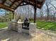 Outdoor kitchen featuring a built-in grill, perfect for entertaining in the backyard and enjoying the weather at 3610 Eagle Emblem Ct, Greenwood, IN 46143
