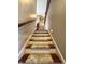 Stairway with hardwood steps and carpet runner leading to the upper level at 3610 Eagle Emblem Ct, Greenwood, IN 46143