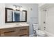 Updated bathroom featuring a modern vanity with a white countertop and a framed mirror at 3661 Yellow Poplar Ct, Indianapolis, IN 46222
