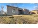 Single-story home with gray siding and a lawn, situated on a bright, sunny day at 3661 Yellow Poplar Ct, Indianapolis, IN 46222