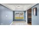 Bright living area with tile flooring and view of window and a shelving nook at 3661 Yellow Poplar Ct, Indianapolis, IN 46222