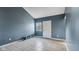 A bright room featuring tile flooring, a window, and a white door at 3661 Yellow Poplar Ct, Indianapolis, IN 46222