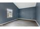 A simple room with wood-look laminate flooring and blue walls at 3661 Yellow Poplar Ct, Indianapolis, IN 46222