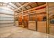 Barn featuring horse stalls with wood framing and metal bars, with hay and accessories present at 3777 S 300 E, Anderson, IN 46017