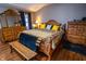 Well-lit bedroom with wooden furniture and decorative accents. Hardwood flooring throughout at 3777 S 300 E, Anderson, IN 46017