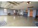 Spacious garage with epoxy flooring, laundry machines, and access to the exterior at 3777 S 300 E, Anderson, IN 46017