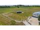 Aerial view of the fenced horse property, featuring a run-in shed and a barn with access to the pastures at 3777 S 300 E, Anderson, IN 46017