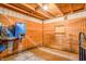 A look inside a horse stall with wood panels, a water bucket, and hay feeding equipment at 3777 S 300 E, Anderson, IN 46017