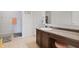 Cozy bathroom featuring tile floors, vanity with dark cabinets, and a shower-tub combination at 380 Winterset Way, Greenwood, IN 46143