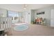 Bright ' room with a crib, soft carpet, neutral walls, and two large windows with outdoor views at 380 Winterset Way, Greenwood, IN 46143