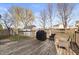 A wooden deck featuring outdoor seating and a grill, perfect for entertaining guests outdoors at 380 Winterset Way, Greenwood, IN 46143