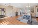 Open dining area with hardwood floors, staircase access, and modern furnishings at 380 Winterset Way, Greenwood, IN 46143