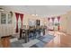 Elegant dining room featuring a large table, modern decor, and plenty of natural light at 380 Winterset Way, Greenwood, IN 46143