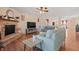 Cozy living room featuring a stone fireplace, hardwood floors, and comfortable seating at 380 Winterset Way, Greenwood, IN 46143