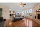 Comfortable living room with hardwood floors, a ceiling fan, and natural light at 380 Winterset Way, Greenwood, IN 46143