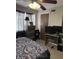 Bedroom featuring ceiling fan, patterned bedding, carpet flooring, and natural light at 4291 Village Parkway W Cir # 8, Indianapolis, IN 46254