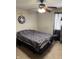 Bedroom featuring ceiling fan, patterned bedding, carpet flooring, and natural light at 4291 Village Parkway W Cir # 8, Indianapolis, IN 46254