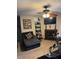 Cozy living room with a fireplace, ceiling fan, and comfortable seating arrangement at 4291 Village Parkway W Cir # 8, Indianapolis, IN 46254