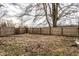Backyard features a large tree and a wooden fence at 4355 W 450 S, Columbus, IN 47201
