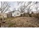 Backyard features a medium-sized yard and a boarded up building at 4355 W 450 S, Columbus, IN 47201