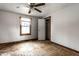 Bedroom with hardwood floors, window and closet access at 4355 W 450 S, Columbus, IN 47201