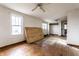Spacious bedroom with hardwood floors, ceiling fan, and natural light at 4355 W 450 S, Columbus, IN 47201