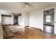 Large bedroom featuring hardwood floors, ceiling fan, and natural light at 4355 W 450 S, Columbus, IN 47201
