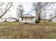 Charming single-story home with a covered porch and a detached garage nestled in a spacious yard at 4355 W 450 S, Columbus, IN 47201