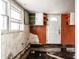 This kitchen features orange paint and lots of cabinets at 4355 W 450 S, Columbus, IN 47201
