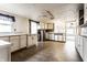 Spacious kitchen with ample cabinet space, tile flooring, and natural light from a window at 4355 W 450 S, Columbus, IN 47201