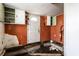 This kitchen features orange paint and lots of cabinets at 4355 W 450 S, Columbus, IN 47201